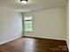 Inviting bedroom filled with natural light and hardwood floors at 12713 Frank Wiley Ln, Charlotte, NC 28278
