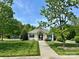 Charming community clubhouse with well-manicured lawn and inviting walkway on a sunny day at 12713 Frank Wiley Ln, Charlotte, NC 28278