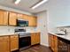 Kitchen featuring stainless steel appliances, wood cabinets and bright countertops at 12713 Frank Wiley Ln, Charlotte, NC 28278