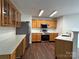 Modern kitchen with stainless steel appliances, white countertops, and ample cabinet space at 12713 Frank Wiley Ln, Charlotte, NC 28278