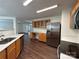 Open kitchen boasts stainless steel appliances and abundant cabinet space at 12713 Frank Wiley Ln, Charlotte, NC 28278