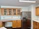 Spacious kitchen with stainless steel appliances and ample wood cabinets at 12713 Frank Wiley Ln, Charlotte, NC 28278