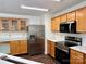 Spacious kitchen with stainless steel appliances and ample wood cabinets at 12713 Frank Wiley Ln, Charlotte, NC 28278