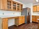 Spacious kitchen with stainless steel appliances and ample wood cabinets at 12713 Frank Wiley Ln, Charlotte, NC 28278