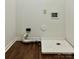 Practical laundry room with modern hookups, space for a washer and dryer, and durable flooring at 12713 Frank Wiley Ln, Charlotte, NC 28278