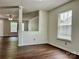 Bright living room featuring hardwood floors, neutral paint, and large windows at 12713 Frank Wiley Ln, Charlotte, NC 28278