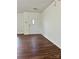 Inviting living room featuring hardwood floors, neutral paint, and plenty of natural light at 12713 Frank Wiley Ln, Charlotte, NC 28278