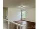Upstairs loft with a view of the backyard at 12713 Frank Wiley Ln, Charlotte, NC 28278