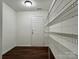 Walk-in pantry with wire shelving for storage at 12713 Frank Wiley Ln, Charlotte, NC 28278