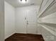 A functional walk-in closet space with an access door and white wire shelving at 12713 Frank Wiley Ln, Charlotte, NC 28278
