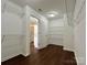 Spacious walk-in closet featuring vinyl floors and wire shelving to maximize storage at 12713 Frank Wiley Ln, Charlotte, NC 28278