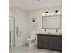 Modern bathroom with double sinks, sleek fixtures, and a glass-enclosed shower at 1354 Briar Creek Rd, Charlotte, NC 28205