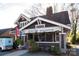Moxie Mercantile exterior boasts a cozy vintage look, attracting shoppers to explore unique retail offerings at 1354 Briar Creek Rd, Charlotte, NC 28205