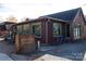 Cozy coffee shop with large windows, outdoor seating, and a bicycle rack at 1354 Briar Creek Rd, Charlotte, NC 28205