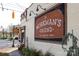 Historic pub with a brick facade, vintage signage, and inviting street appeal at 1354 Briar Creek Rd, Charlotte, NC 28205