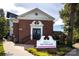 Inviting brick building with elegant architectural details, and manicured landscaping at 1354 Briar Creek Rd, Charlotte, NC 28205