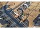 Aerial view of the home showcasing the backyard, putting green, covered patio, and the neighborhood at 14004 Fiery Mist Way, Huntersville, NC 28078