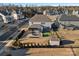 Aerial view of a home with a backyard featuring an outdoor kitchen, dining area, and well manicured lawn at 14004 Fiery Mist Way, Huntersville, NC 28078