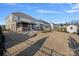 Expansive backyard featuring a covered patio, outdoor seating, and ample space for entertaining and relaxation at 14004 Fiery Mist Way, Huntersville, NC 28078