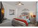 Cozy bedroom with stylish decor, a comfortable bed, and soft lighting for a relaxing ambiance at 14004 Fiery Mist Way, Huntersville, NC 28078
