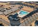 Aerial view of the community pool, clubhouse, playground, and surrounding parking area at 14004 Fiery Mist Way, Huntersville, NC 28078