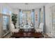 Bright dining area with large windows, modern lighting, and comfortable seating for Gathering meals at 14004 Fiery Mist Way, Huntersville, NC 28078