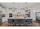 Modern kitchen with white cabinets, stainless steel appliances, granite countertops, and decorative pendant lights at 14004 Fiery Mist Way, Huntersville, NC 28078