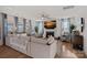 Bright living room features fireplace, TV, hardwood floors, comfortable seating, and lots of natural light at 14004 Fiery Mist Way, Huntersville, NC 28078