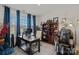 Bright home office with a large window, desk, bookcase, and a massage chair for ultimate relaxation at 14004 Fiery Mist Way, Huntersville, NC 28078