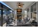 Covered patio with a stone fireplace, comfortable seating, and an outdoor living space at 14004 Fiery Mist Way, Huntersville, NC 28078