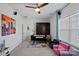 Bright recreation room with cozy seating, a dark cabinet, and playful decorations at 14004 Fiery Mist Way, Huntersville, NC 28078