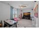 Spacious recreation room with plush carpeting and an entertainment center for Gathering fun at 14004 Fiery Mist Way, Huntersville, NC 28078