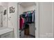 Walk-in closet with ample storage and organization, showcasing various clothing and accessories neatly arranged at 14004 Fiery Mist Way, Huntersville, NC 28078