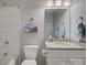 Bright bathroom with white subway tile shower, granite countertop vanity, and modern fixtures at 15824 Feeny Ct, Charlotte, NC 28278