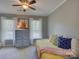 Inviting bedroom with a trundle bed, stylish decor, and sunlit windows at 15824 Feeny Ct, Charlotte, NC 28278