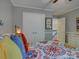 Comfortable bedroom featuring an inviting bed and view into hallway with hardwood flooring at 15824 Feeny Ct, Charlotte, NC 28278
