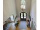 Grand foyer with a soaring ceiling, decorative chandelier, and double front doors at 15824 Feeny Ct, Charlotte, NC 28278
