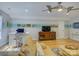 Comfortable living room with hardwood floors, ceiling fan, and built-in media cabinet at 15824 Feeny Ct, Charlotte, NC 28278