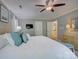 Spacious main bedroom featuring neutral decor, a ceiling fan, and soft natural light from the windows at 15824 Feeny Ct, Charlotte, NC 28278