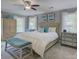 Serene main bedroom with soft gray walls, a ceiling fan, and neutral furnishings at 15824 Feeny Ct, Charlotte, NC 28278