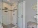 Elegant glass shower with sleek fixtures, decorative tile accents, and a built-in bench at 15824 Feeny Ct, Charlotte, NC 28278