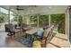 Inviting sunroom with a comfortable seating area and natural light offers tranquil backyard views for year-round enjoyment at 15824 Feeny Ct, Charlotte, NC 28278