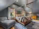 Comfortable bedroom with a four-poster bed, a sitting area, and natural light from the window at 1614 Brook Rd, Charlotte, NC 28205