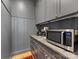 Gray butler's pantry features granite countertops and includes a microwave and coffee maker at 1614 Brook Rd, Charlotte, NC 28205