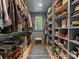 Spacious walk-in closet with custom shelving and ample storage for clothes and shoes at 1614 Brook Rd, Charlotte, NC 28205