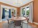 Elegant dining room with a round table, gray chairs and plenty of natural light at 1614 Brook Rd, Charlotte, NC 28205