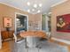 Elegant dining room with a round table, gray chairs and plenty of natural light at 1614 Brook Rd, Charlotte, NC 28205