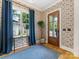 Stylish foyer with hardwood floors, designer wallpaper, and a view of the front yard at 1614 Brook Rd, Charlotte, NC 28205