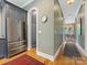 Light-filled hallway with wood floors, leading to an open dining area and kitchen space at 1614 Brook Rd, Charlotte, NC 28205