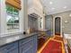 Well-appointed kitchen with stainless steel appliances, stone countertops, and wood floors at 1614 Brook Rd, Charlotte, NC 28205